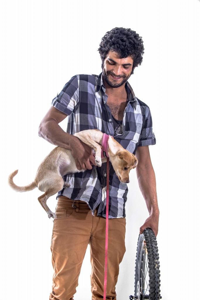 In Tel Aviv’s bohemian center of Florentine, hipsters like Shachar (and puppy) blend global trends into the Mideast‘s un-self-conscious ease. Photo: The Tower/Aviram Valdman