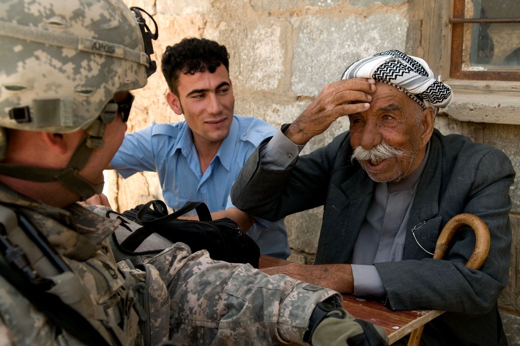 A Kurdish elder shows off his English to American troops in a village near Kirkuk, Iraq. Photo: US Department of Defense.