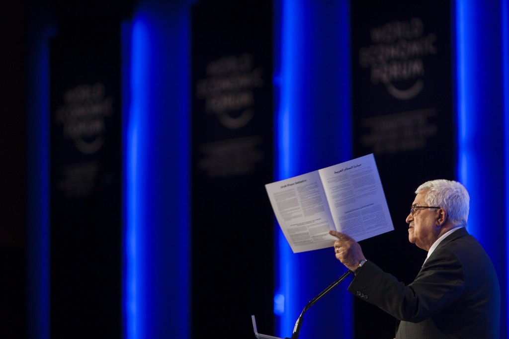 Palestinian Authority Chairman Mahmoud Abbas, holding the Arab peace initiative document, May 2013. Photo: Flash90