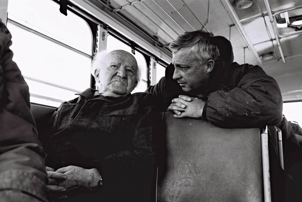 Major General Ariel Sharon talks with David Ben-Gurion during a bus ride along the Israeli Army positions on the Egyptian border.