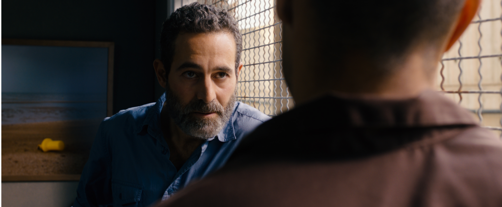 Rami (Waleed F. Zuaiter), an Israeli intelligence operative, makes a deal to free Omar from a long prison sentence in exchange for becoming a double agent. Photo: Adopt Films