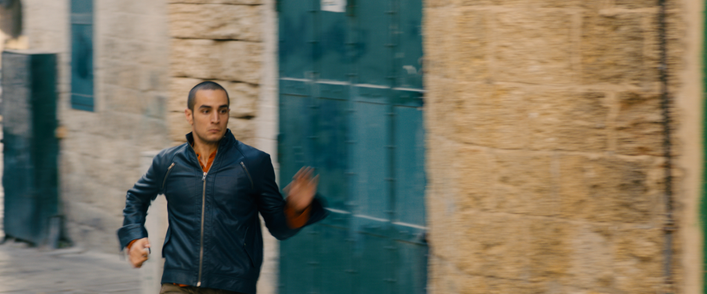 Omar (Adam Bakri) is on the run from Israeli agents who are pursuing the Palestinian murderer of an Israeli soldier. Photo: Adopt Films