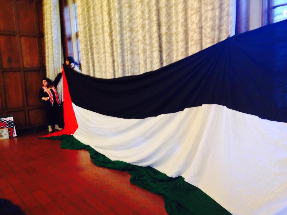 A Palestinian flag unfurled at the Central Student Government's second vote on the BDS resolution. Photo: Ellie Geller
