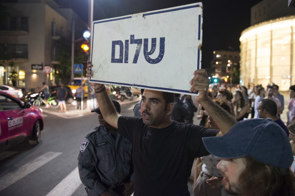 Left-wing activists rally at Habima Square, Tel Aviv, against the recent escalation of violence and racial hatred, July 3, 2014. Photo: Danielle Shitrit / Flash90
