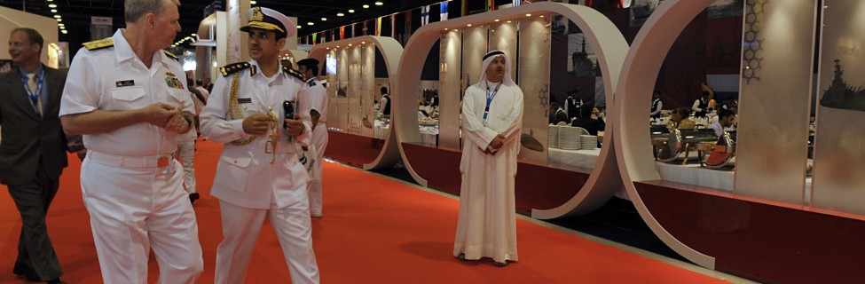 Chief of Naval Operations (CNO) Adm. Gary Roughead, left, speaks with Qatari Col. Abdullah Eid Al-Bourdainiby at the Doha International Maritime Defense Exhibition Mid East Naval Commander's Conference in Doha, Qatar. Photo: Tiffini Jones Vanderwyst / U.S. Navy / Wikimedia