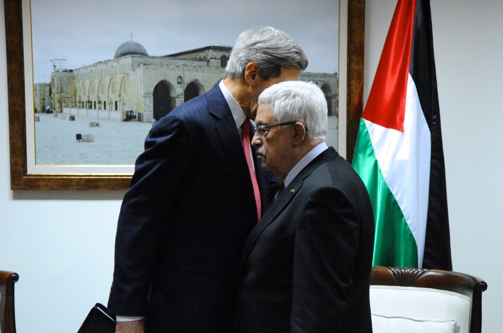 U.S. Secretary of State John Kerry has a private chat with Palestinian Authority President Mahmoud Abbas before a meeting in Ramallah, West Bank, on December 12, 2013. Photo: U.S. Department of State / Wikimedia