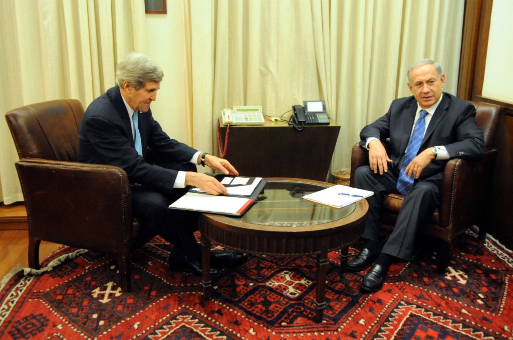 U.S. Secretary of State John Kerry and Israeli Prime Minister Benjamin Netanyahu settle into their seats in Netanyahu's private office before a one-one-one discussion in Jerusalem on January 2, 2014. Photo: U.S. Department of State / Wikimedia