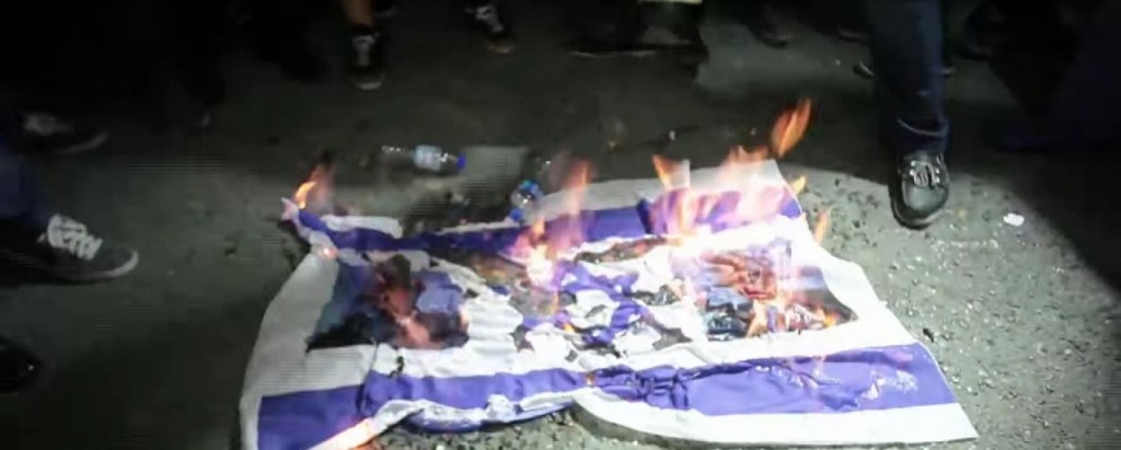 Turkish protesters burn an Israeli flag outside the Israeli consulate in Istanbul. Photo: RuptlyTV / YouTube