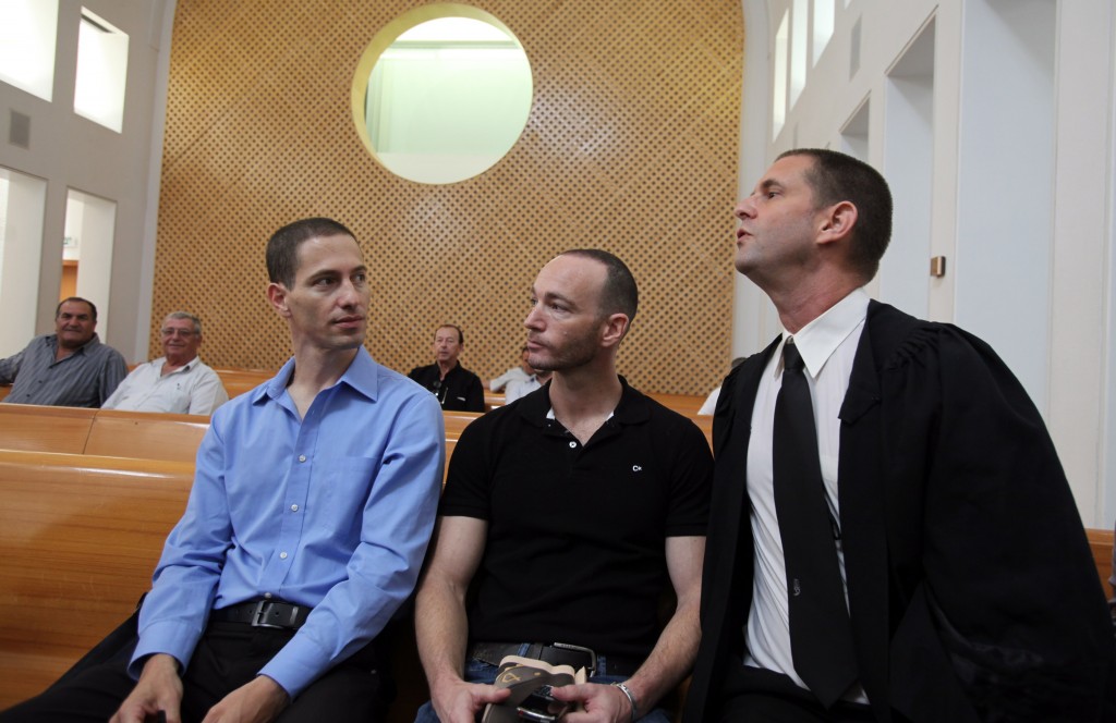 Etai Pinkas (L) and Yoav Arad (Middle), gay activists from Tel Aviv, with their attorney Dori Spibak (R), petitioned the Supreme Court in 2010 to be permitted to have a baby through a surrogate mother. Photo: Yossi Zamir / Flash90