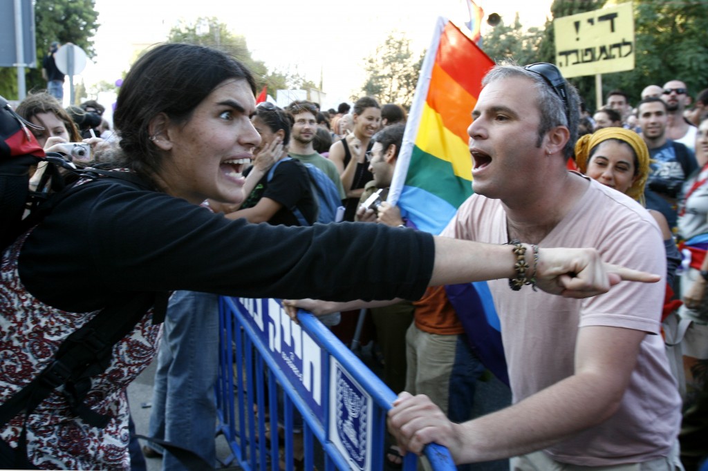 An Israeli gay man argues with a religious anti-gay protestor at the 2007 Jerusalem Gay Pride Parade. Photo: Nati Shohat / Flash90