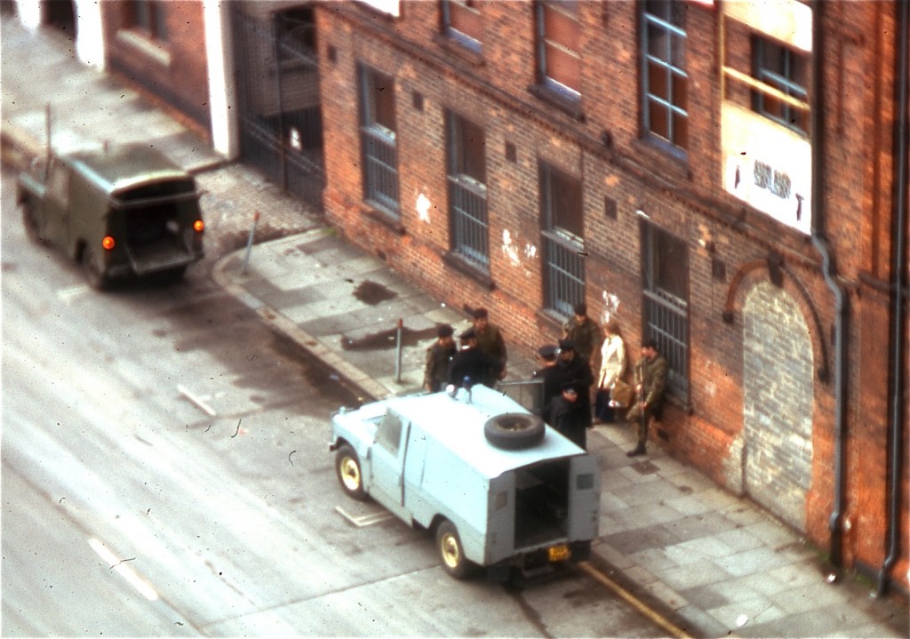1974: British troops interrogate a couple outside Belfast’s Europa Hotel, which was known as the “most bombed hotel in the world” after suffering 28 bomb attacks during the Troubles. Photo: George Louis / Wikimedia