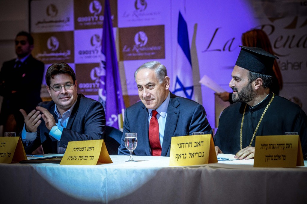 Israeli Prime Minister Benjamin Netanyahu (center) speaks at an event thrown by the Forum for Christian Enlistment in the Israel Defense Forces. Next to him is Father Gabriel Naddaf. Photo: Aviram Valdman / The Tower