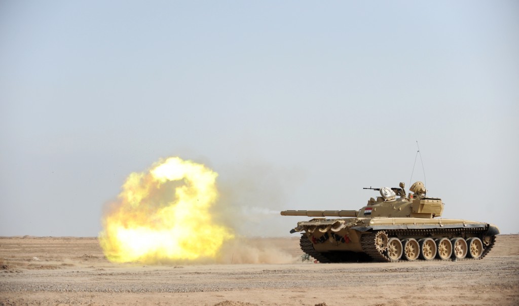 An Iraqi T-72 tank fires during a live fire training exercise at the Besmaya Gunnery Range near Baghdad. Photo: Jacob H. Smith / U.S. Army / Wikimedia