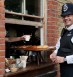 A British policeman buys lunch at Columbia Market, London. Photo: Jorge Royan / Wikimedia