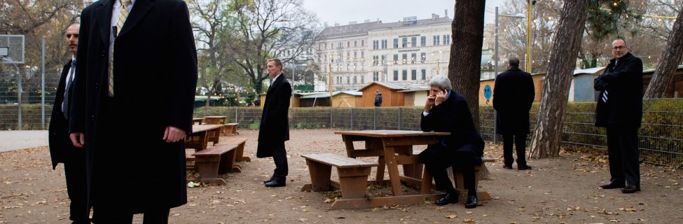 U.S. Secretary of State John Kerry, ringed by security guards, speaks with Canadian Foreign Minister John Baird about the status of nuclear program negotiations with Iranian officials as he sits in a park at the scene of the talks, Vienna, Austria, on November 22, 2014. Photo: U.S. Department of State / flickr