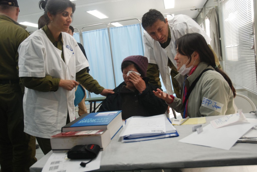 An Israeli medical delegation traveled to Japan to assist after the devastating earthquake and tsunami in 2011. Following publications in Japanese news outlets regarding the opening of an Israeli medical clinic in Minamisanriku, Setsukao Yamauchi, an 80-year-old woman, walked three hours from her distant village to be treated by Lt. Col. Dr. Orly Weinstein, an Israeli eye specialist. Photo: Israel Defense Forces / Wikimedia