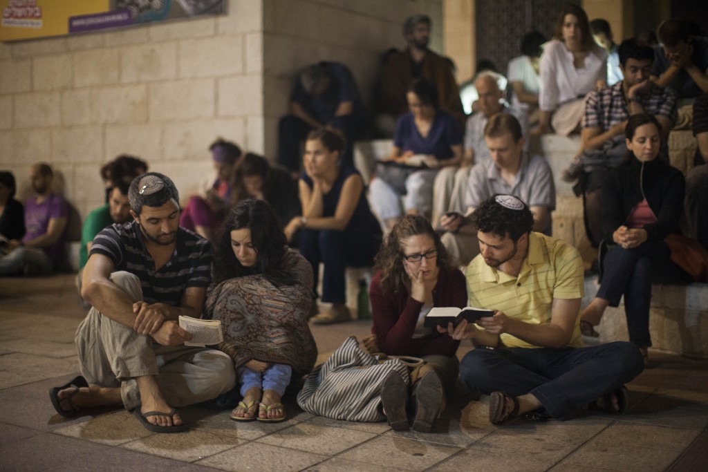 Conservative Jews pray as they gather for the mournful holiday of Tisha B'Av at Safra Square in Jerusalem, July 15, 2013. Photo: Yonatan Sindel / Flash90. 