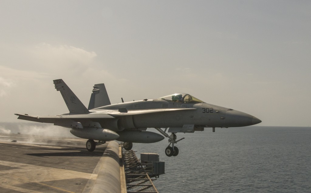 An F/A-18C Super Hornet launches from the U.S. Navy aircraft carrier USS Carl Vinson, March 3, 2015. Carl Vinson is deployed in the U.S. 5th Fleet area of operations supporting Operation Inherent Resolve, which conducts airstrikes against ISIS targets in Iraq and Syria. Photo: MCS 2nd Class John Philip Wagner, Jr. / U.S. Navy / flickr