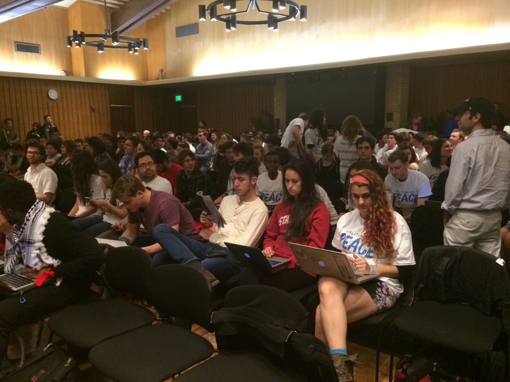 Students from the Stanford Coalition for Peace sit near the back of the hearing room during the Undergraduate Senate's first debate on divestment. Photo: Miriam Pollock / The Tower