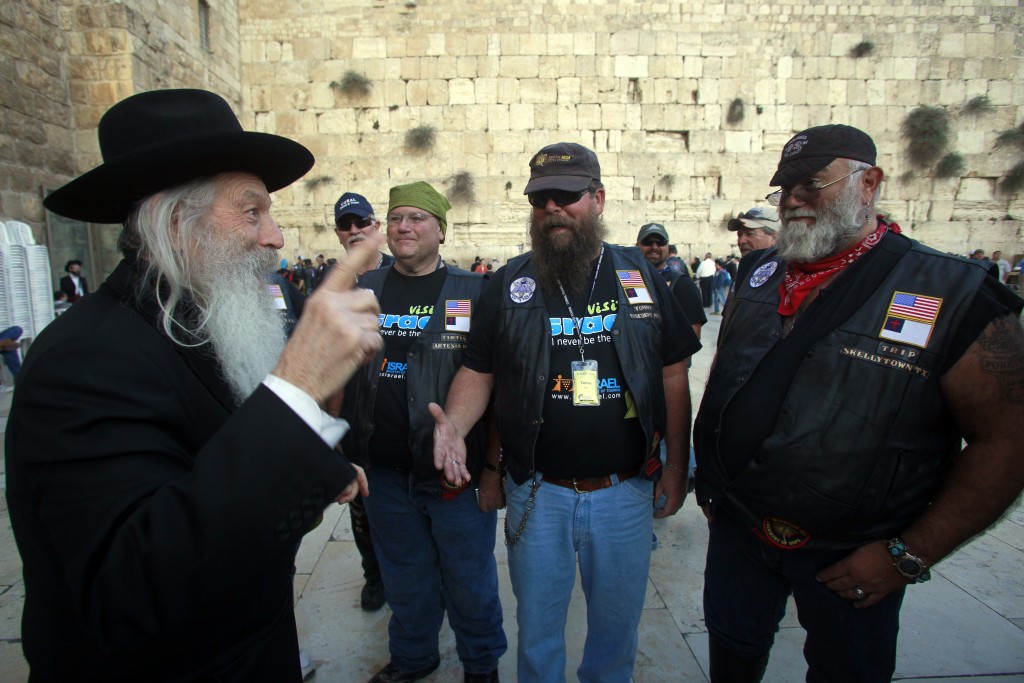 Participants of a delegation of Evangelical motorcyclists from the United States arrive at the Western Wall in Jerusalem, November 6, 2011. The organization Mission M25, consisting of Evangelical pastors and military veterans, ride through Israel on a nine-day motorcade on Harley Davidson motorbikes. Photo: Uri Lenz/ Flash 90