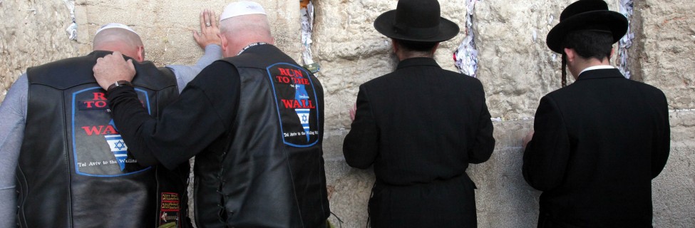Participants of a delegation of Evangelical motorcyclists from the United States pray at the Western Wall in Jerusalem, November 6, 2011. The organization Mission M25, consisting of Evangelical pastors and military veterans, ride through Israel on a nine-day motorcade on Harley Davidson motorbikes. Photo: Yossi Zamir / Flash 90