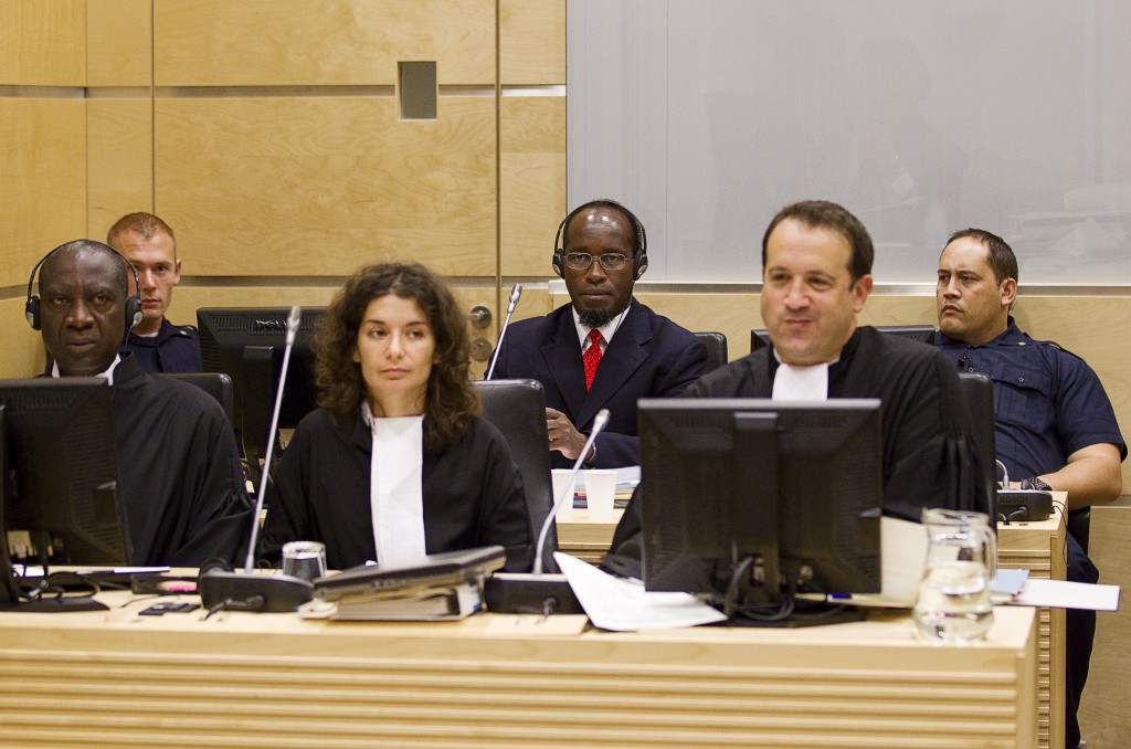 Callixte Mbarushimana is seen behind his defense team at the opening of the confirmation of charges hearings at the International Criminal Court in The Hague, September 15, 2011. Mbarushimana, a senior leader of the rebel group FDLR during the conflict in the Democratic Republic of the Congo, is charged with 11 counts of crimes against humanity and war crimes, including murder and rape. Photo: Jerry Lampen / Flash90
