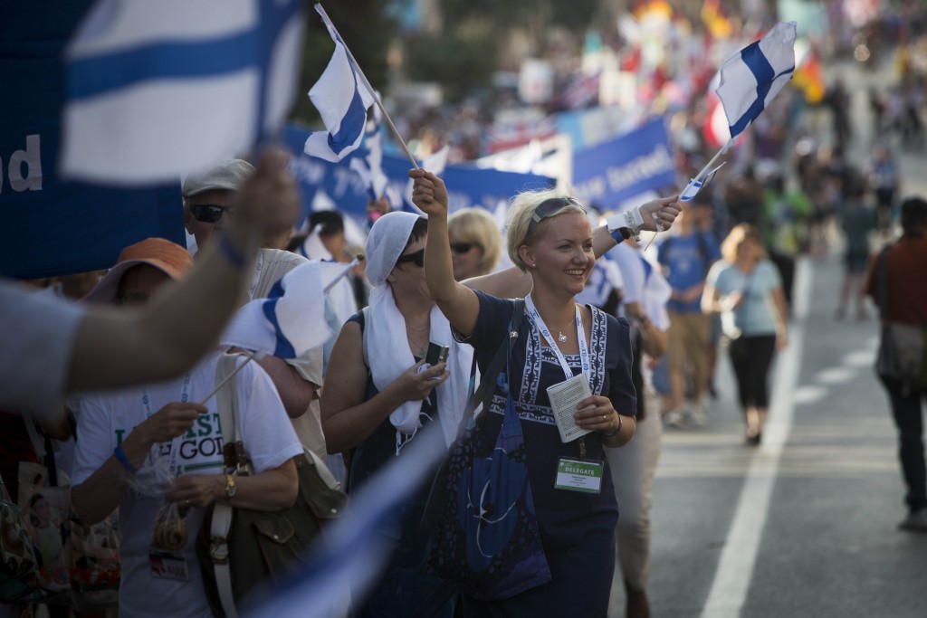 An Evangelical supporter of Israel waves during the annual parade in Jerusalem, marking the Jewish holiday of Sukkot, October 4, 2012. The parade take place every year during Sukkot, with many delegations from Israel and abroad. Photo: Yonatan Sindel / Flash90