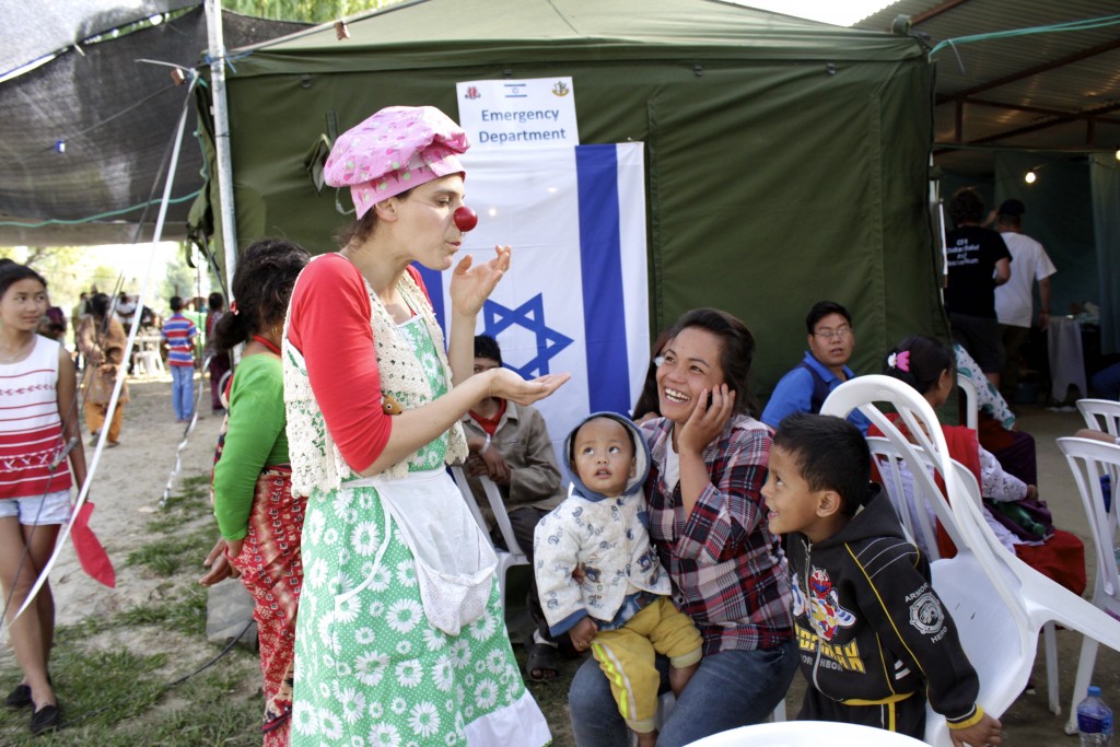 A clown entertains children at the Israeli field hospital in Nepal. Photo: Yardena Schwartz / The Tower