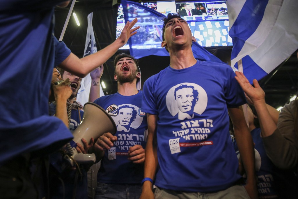 Supporters of the Zionist Union celebrate at the party’s election headquarters in Tel Aviv after the exit polls in the Israeli general elections were announced, March 17, 2015. Photo: Hadas Parush / Flash90