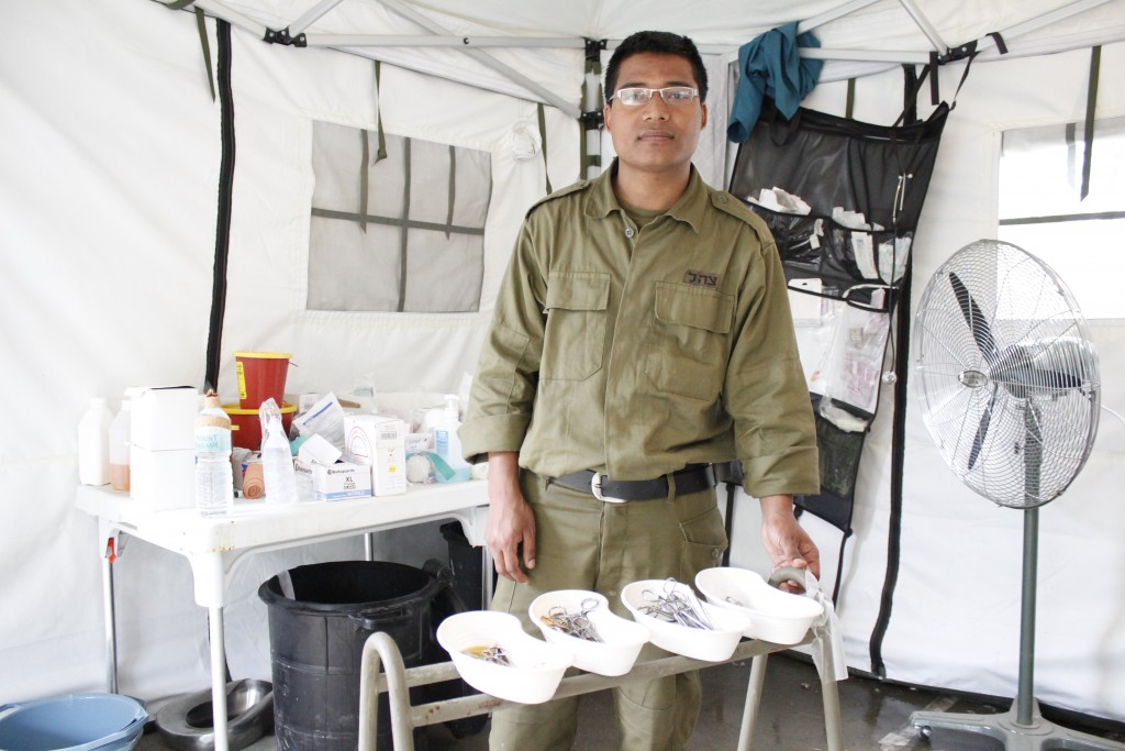 Nepali doctor Krishna Kashichawa, who is doing his residency at Hadassah Medical Center in Jerusalem, returned to Nepal for the first time in two years as part of the IDF’s medical aid mission. Photo: Yardena Schwartz / The Tower