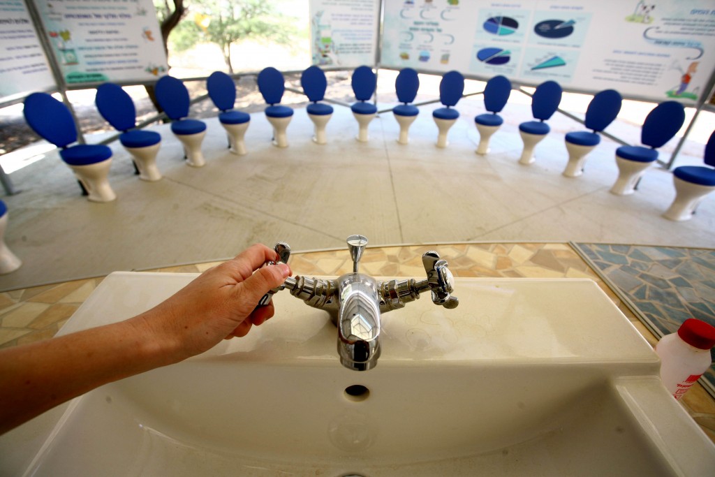 A faucet and toilets are presented in a classroom in the ecological village in Nitzana. Students there learn about desalination and how to save water. Photo: Chen Leopold / Flash90