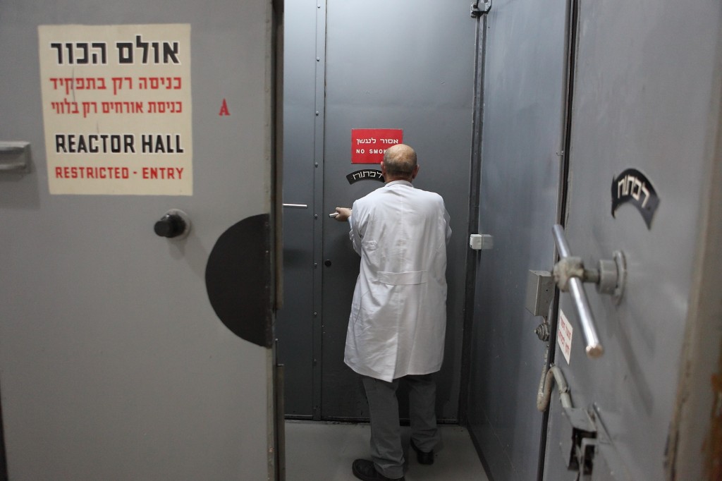 A scientist enters the reactor hall of the nuclear facility in Nahal Sorek. Unlike the nuclear reactor at Dimona, the reactor at Nahal Sorek is inspected by the International Atomic Energy Agency twice a year. Photo: Yaakov Naumi / Flash90