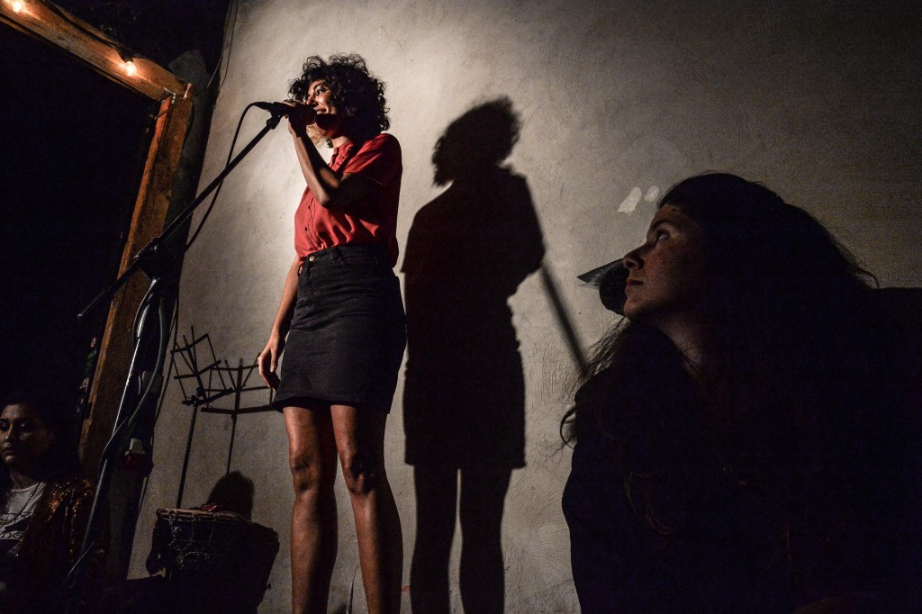 A poet shares her work at an Ars Poetica reading. Photo: Aviram Valdman / The Tower