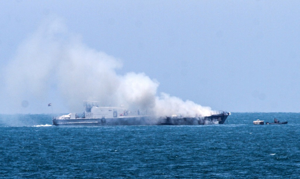 Smoke billows from an Egyptian naval vessel on the maritime border between Egypt and the Gaza Strip, July 16, 2015. The Egyptian military said that the vessel was set ablaze during a clash with militants in the Sinai Peninsula. Photo: Abed Rahim Khatib / Flash90