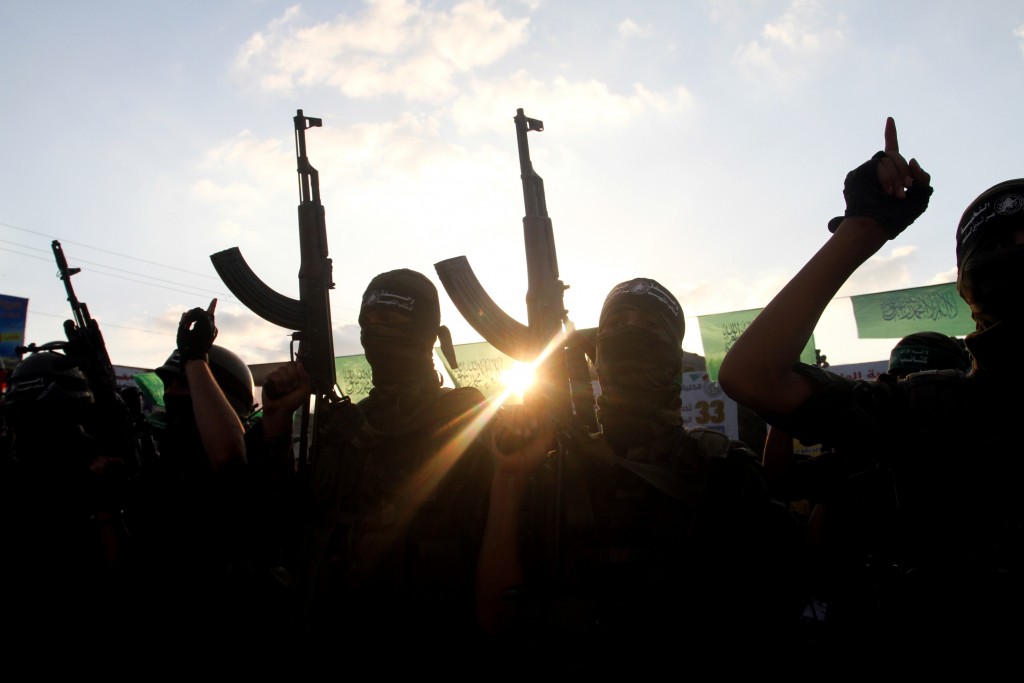 Hamas soldiers take part in a military parade marking the first anniversary of the killing of Hamas's military commanders Mohammed Abu Shammala and Raed al-Attar, in Rafah, Gaza Strip, August 21, 2015. Abu Shammala and al-Attar were killed by an Israeli air strike during a 50-day war between the terror group and Israel the previous summer. Photo: Abed Rahim Khatib / Flash90