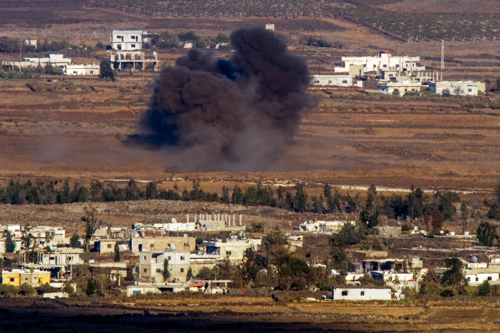 Smoke rises from a Syria village near the border with Israel, as seen from the Golan Heights, September 8, 2014. Photo: Flash90