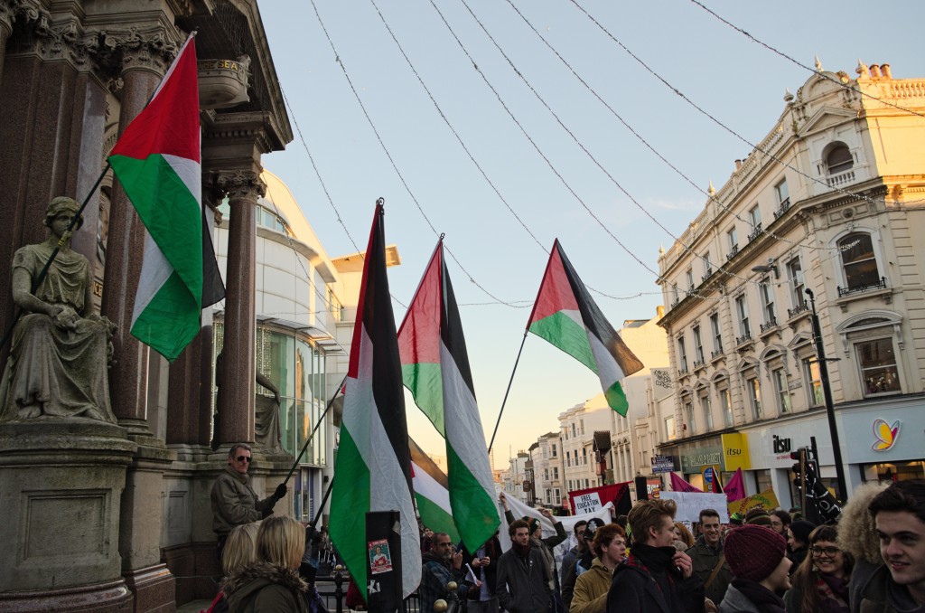 Palestinian flags fly at the March for Free Education in Brighton, UK, June 2014. Photo: Daniel Hadley / flickr