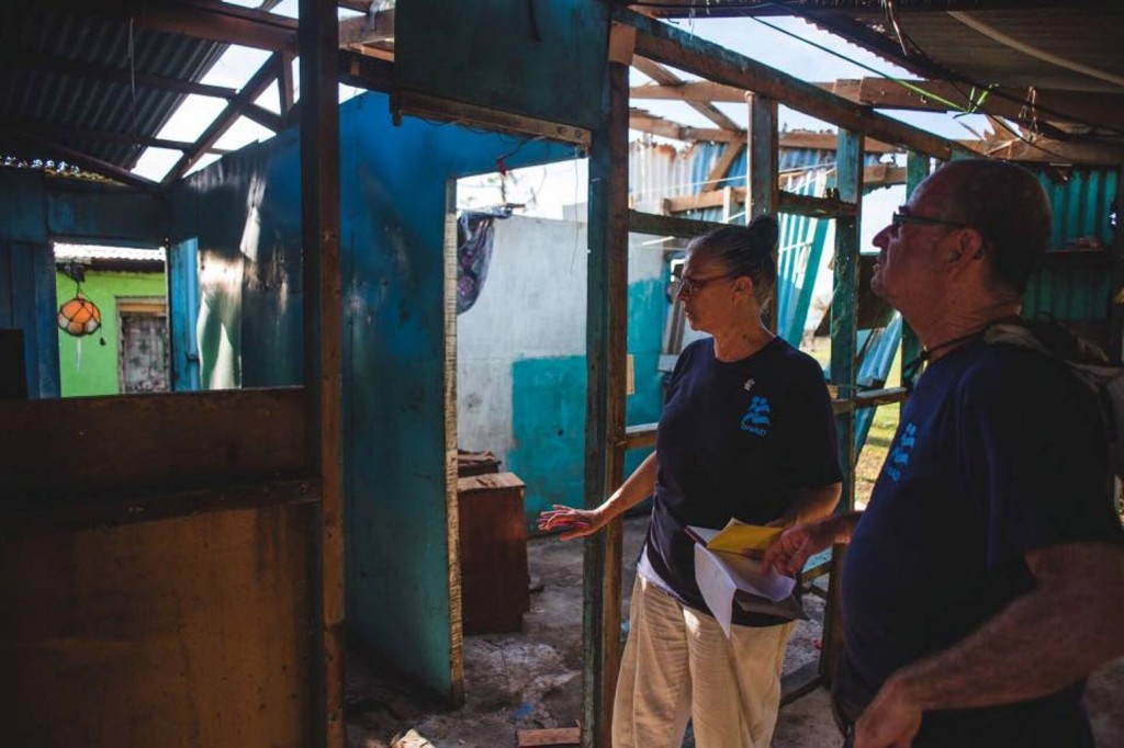 IsraAID volunteers assessing damage to a structure in Fiji.