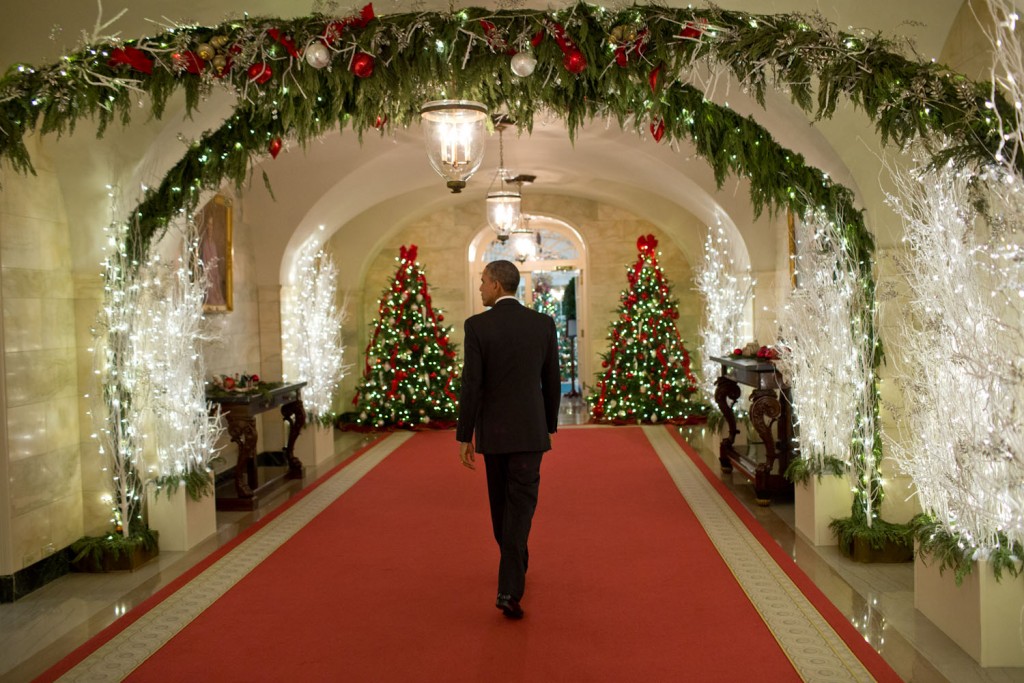 President Barack Obama walks through the White House following a holiday reception, December 12, 2014. Photo: Pete Souza / White House