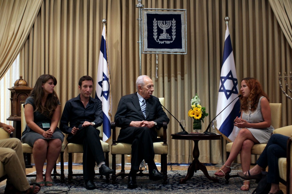 Protest leaders (from left) Daphne Leef, Itzik Shmuli and Stav Shaffir meet with Israeli President Shimon Peres, August 1, 2011. Peres remarked that he was surprised by the intensity of the protests. Photo: Kobi Gideon / Flash90