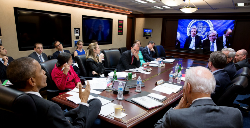 March 31, 2015: President Obama and senior advisors—including Vice President Joe Biden, National Security Advisor Susan Rice, Deputy National Security Advisor for Strategic Communications Ben Rhodes, Treasury Secretary Jack Lew, and Chief of Staff Denis McDonough—confer in the Situation Room via satellite with Secretary of State John Kerry and Energy Secretary Ernest Moniz, who were in Switzerland negotiating the Iran nuclear deal. Photo: Pete Souza / White House