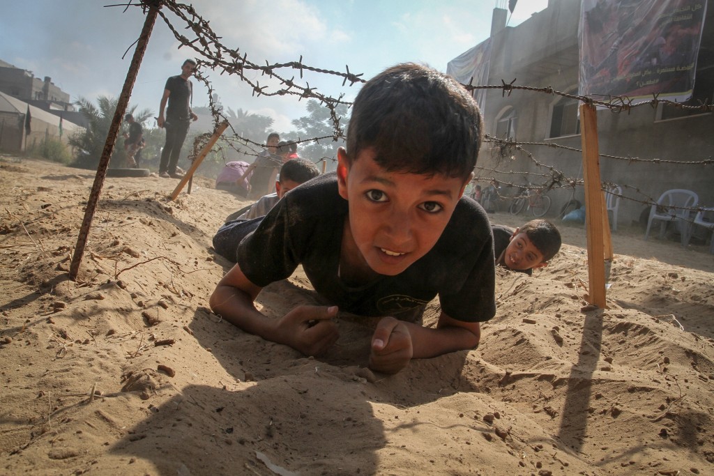 Young Palestinians take part in a military-style exercise at a summer camp organized by the Palestinian Islamic Jihad movement in Khan Yunis, Gaza Strip, July 2016. Photo: Abed Rahim Khatib / Flash90