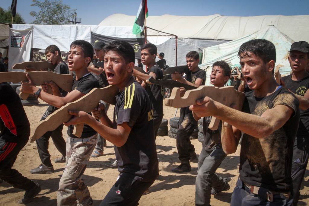 Young Palestinians take part in a military-style exercise at a summer camp organized by the Palestinian Islamic Jihad movement in Khan Yunis, Gaza Strip, July 2016. Photo: Abed Rahim Khatib / Flash90