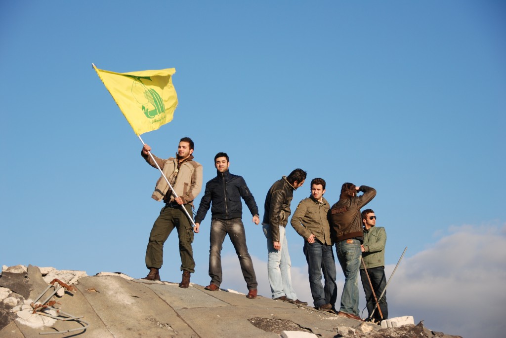 Youth in Beirut pose with the Hezbollah flag. Photo: Paul Keller / flickr