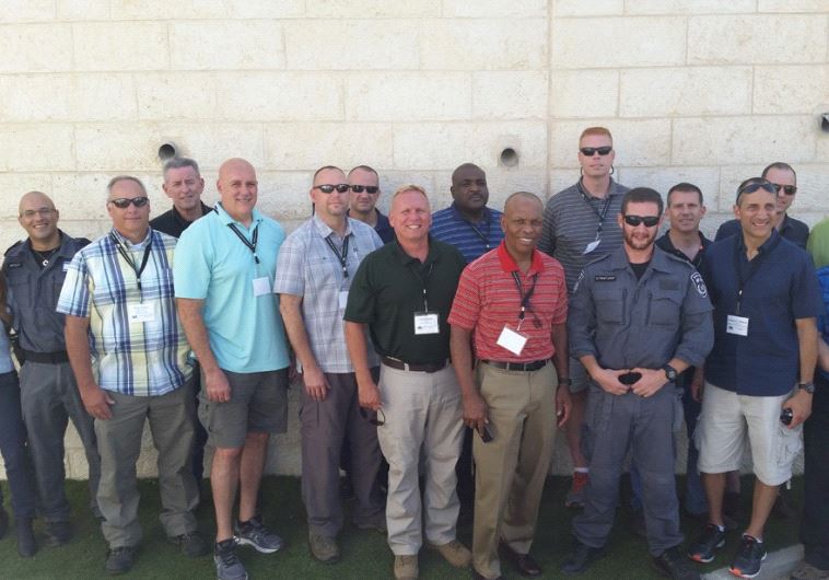 Senior U.S. law enforcement officials with Israeli counterparts in Jerusalem