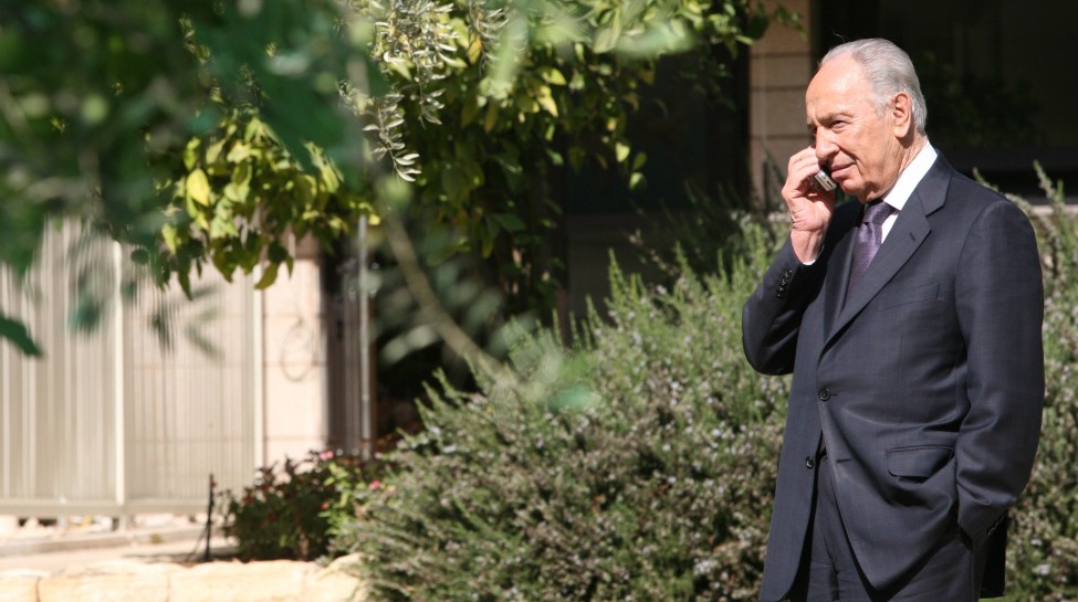 President Shimon Peres talks on his cell phone outside his residence, October 29, 2007. Photo: Maya Levin / Flash90
