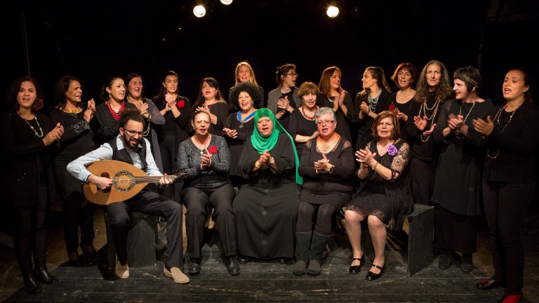 Rana Choir with founder-conductor Mika Danny (center back row, wearing glasses) and artistic director Idan Toledano, front left. Photo by Noa Ben Shalom