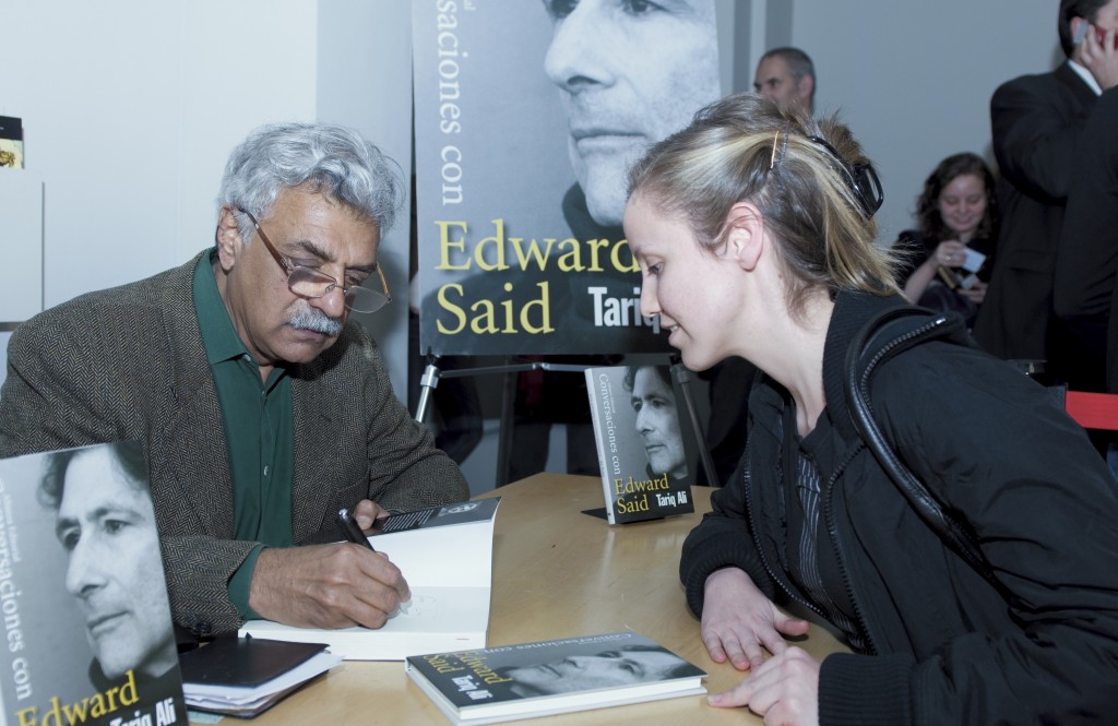 Tariq Ali signs a copy of his book Conversations with Edward Said in Cordoba, Spain. Photo: Fundación Córdoba Capital Europea de la Cultura / flickr