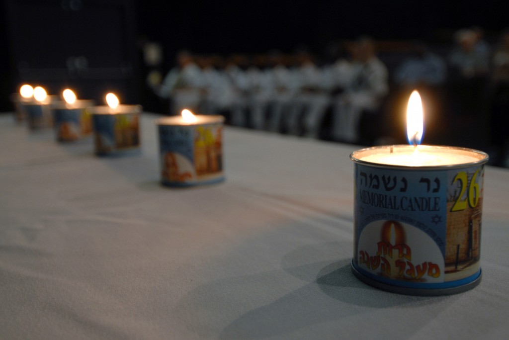 Memorial candles are lit during a Holocaust Remembrance Day ceremony at Naval Station Pearl Harbor. Photo: Mass Communication Specialist 1st Class James E. Foehl / U.S. Navy