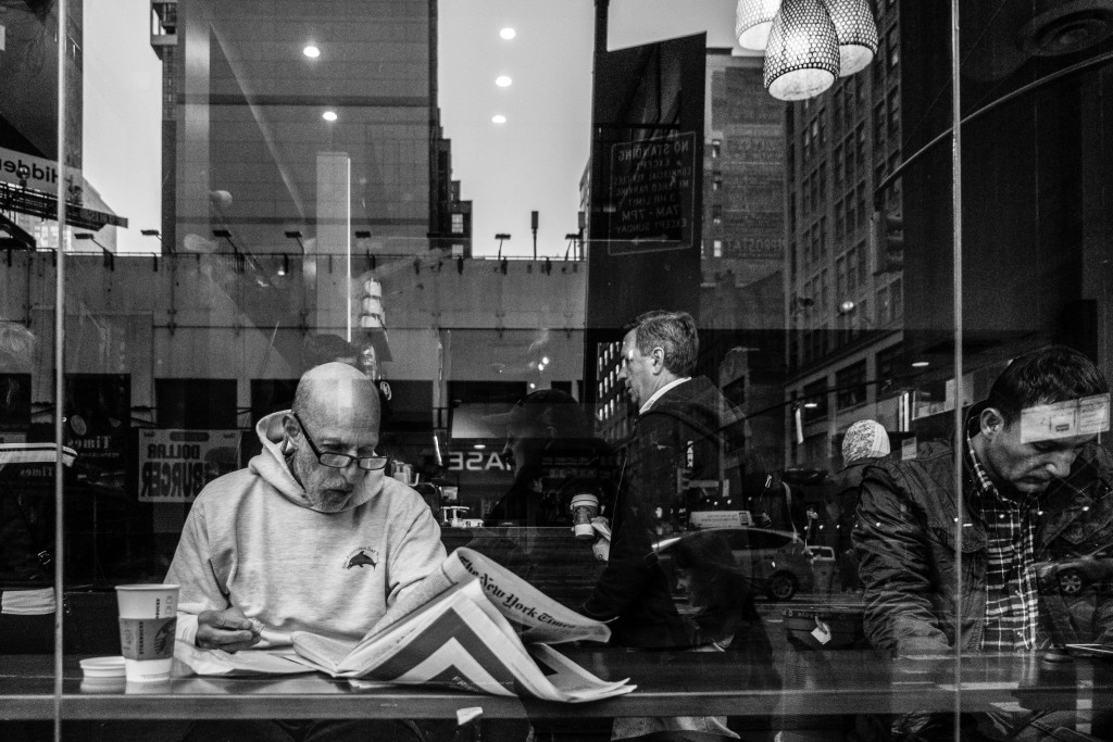 A man reads The New York Times in Manhattan. Photo: Jim Pennucci / flickr
